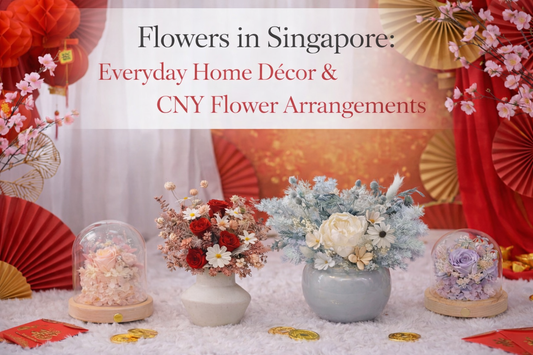Preserved flower arrangements in glass domes and ceramic vases for Chinese New Year home décor in Singapore.