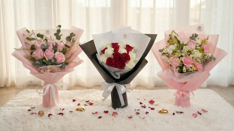 Three anniversary flower bouquets Singapore — pink roses, red and white roses, and mixed blooms with hearts and rose petals