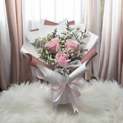 Pink rose bouquet with baby's breath and purple caspia