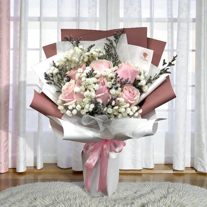 Pink rose bouquet with baby's breath and purple caspia