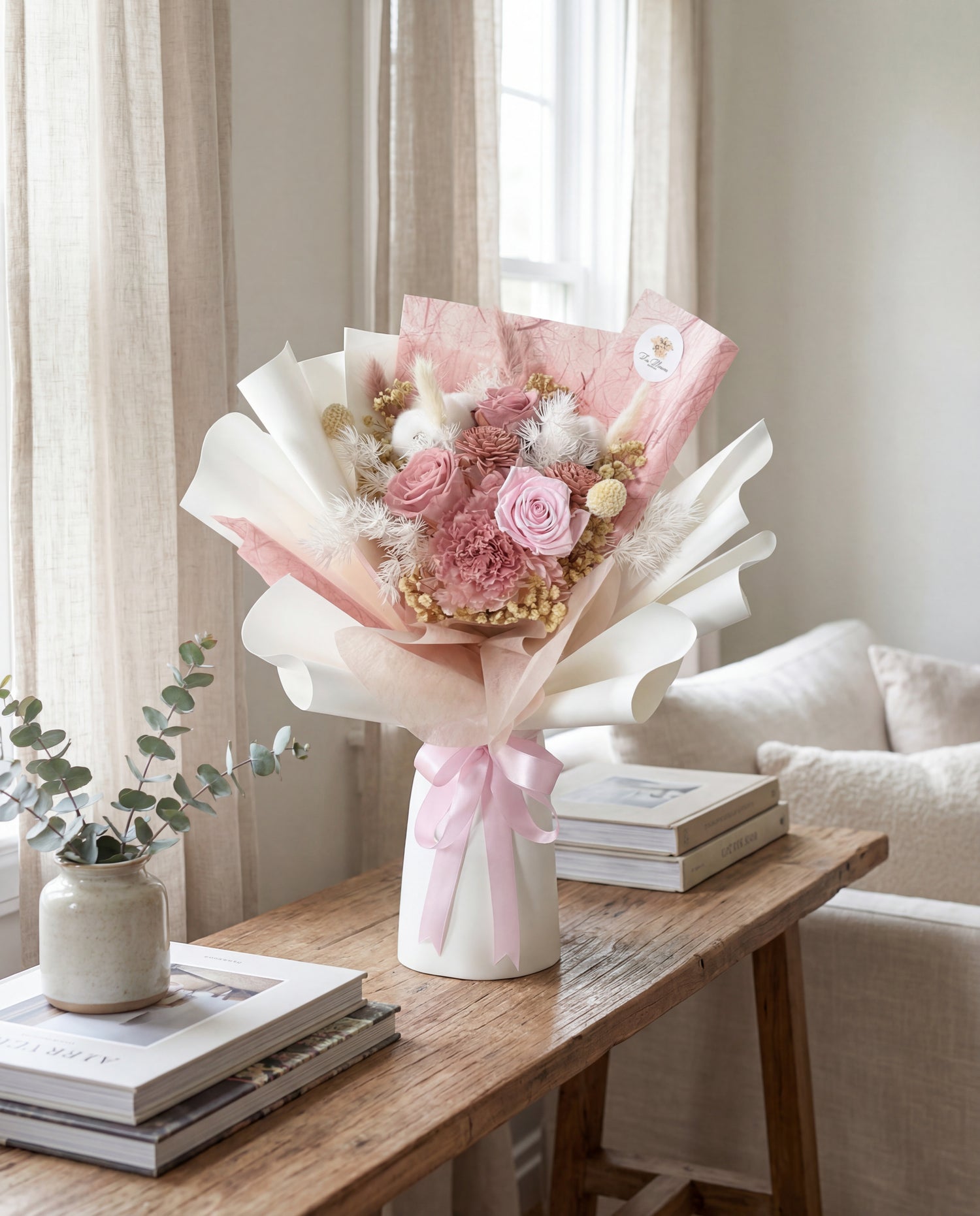 Arizona preserved flower bouquet with pink roses and cotton flowers on wooden table in Singapore home